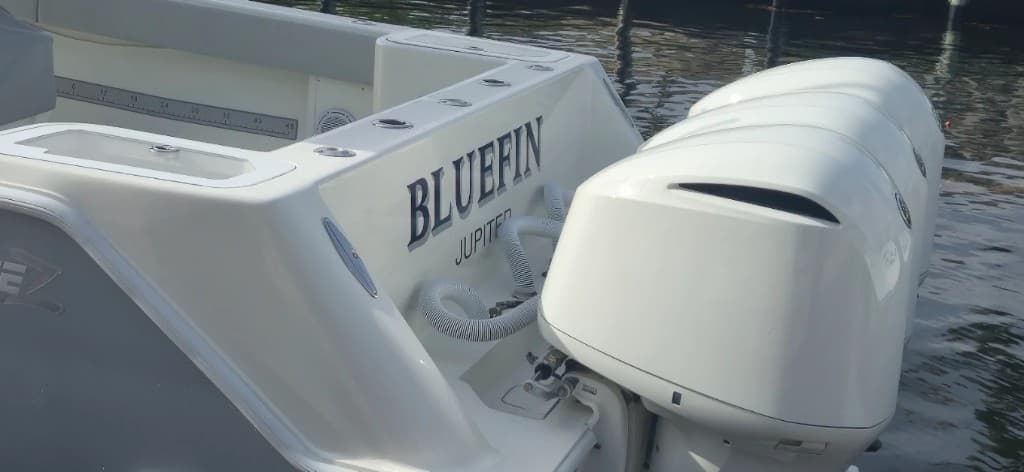 BLUEFIN name and JUPITER hailing port on a white sportfishing transom