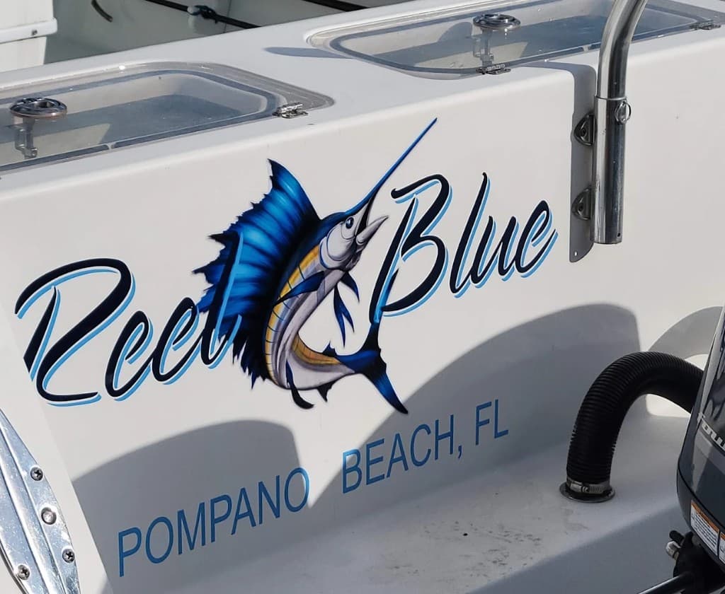 Reel Blue script lettering with a sailfish graphic and Pompano Beach port